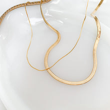 Load image into Gallery viewer, 18k gold filled herringbone chain. A classic necklace that never goes out of style. High quality, tarnish resistant. Shown layered with thin snake chain.