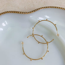 Load image into Gallery viewer, 18k gold filled thin hoop earrings with ball stud detail. Open hoop, push back closure. Lightweight, high quality, tarnish resistant. Shown in 1.75 inches size.