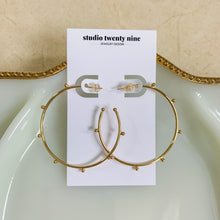 Load image into Gallery viewer, 18k gold filled thin hoop earrings with ball stud detail. Open hoop, push back closure. Lightweight, high quality, tarnish resistant. Shown in 1.75 inches size.