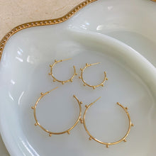 Load image into Gallery viewer, 18k gold filled thin hoop earrings with ball stud detail. Open hoop, push back closure. Lightweight, high quality, tarnish resistant. Shown in 2 available sizes - 1 inch and 1.75 inches.