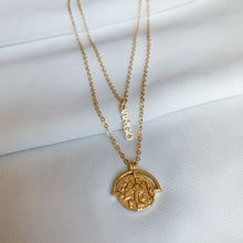 Load image into Gallery viewer, 14k gold filled custom zodiac sign necklace. Double sided zodiac coin medallion on cable chain. High quality, tarnish resistant. Choose your zodiac sign. Pictured in Virgo, and shown layered with our dainty Virgo zodiac word bar necklace.