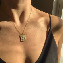 Load image into Gallery viewer, The Explorer 14k gold filled rectangle compass pendant on 14k gold filled cable chain. Jewelry for the traveler or adventurer. High quality, tarnish resistant. Graduation gift, retirement gift, promotion gift or new job gift. Shown on model at 16" length.