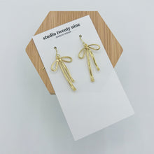 Load image into Gallery viewer, Gold Bow Dangle Earrings

