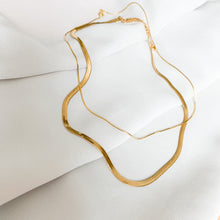 Load image into Gallery viewer, 18k gold filled herringbone chain. A classic necklace that never goes out of style. High quality, tarnish resistant. Shown layered with a thin snake chain.
