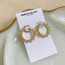 Load image into Gallery viewer, 24k gold filled micro pave spike hoop earrings. 1.5 inch huggies made with clear CZ stones. High quality, tarnish resistant. Trendy statement earrings with rave reviews.
