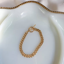 Load image into Gallery viewer, 18k gold filled Cuban curb chain bracelet with toggle clasp. High quality, tarnish resistant. Perfect to stack with other bracelets.
