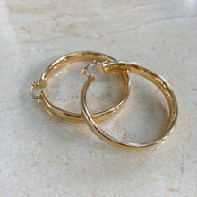 Load image into Gallery viewer, 18k gold filled thick hoop earrings. Wide, flat, continuous hoop style with lever closure. Lightweight. High quality, tarnish resistant.
