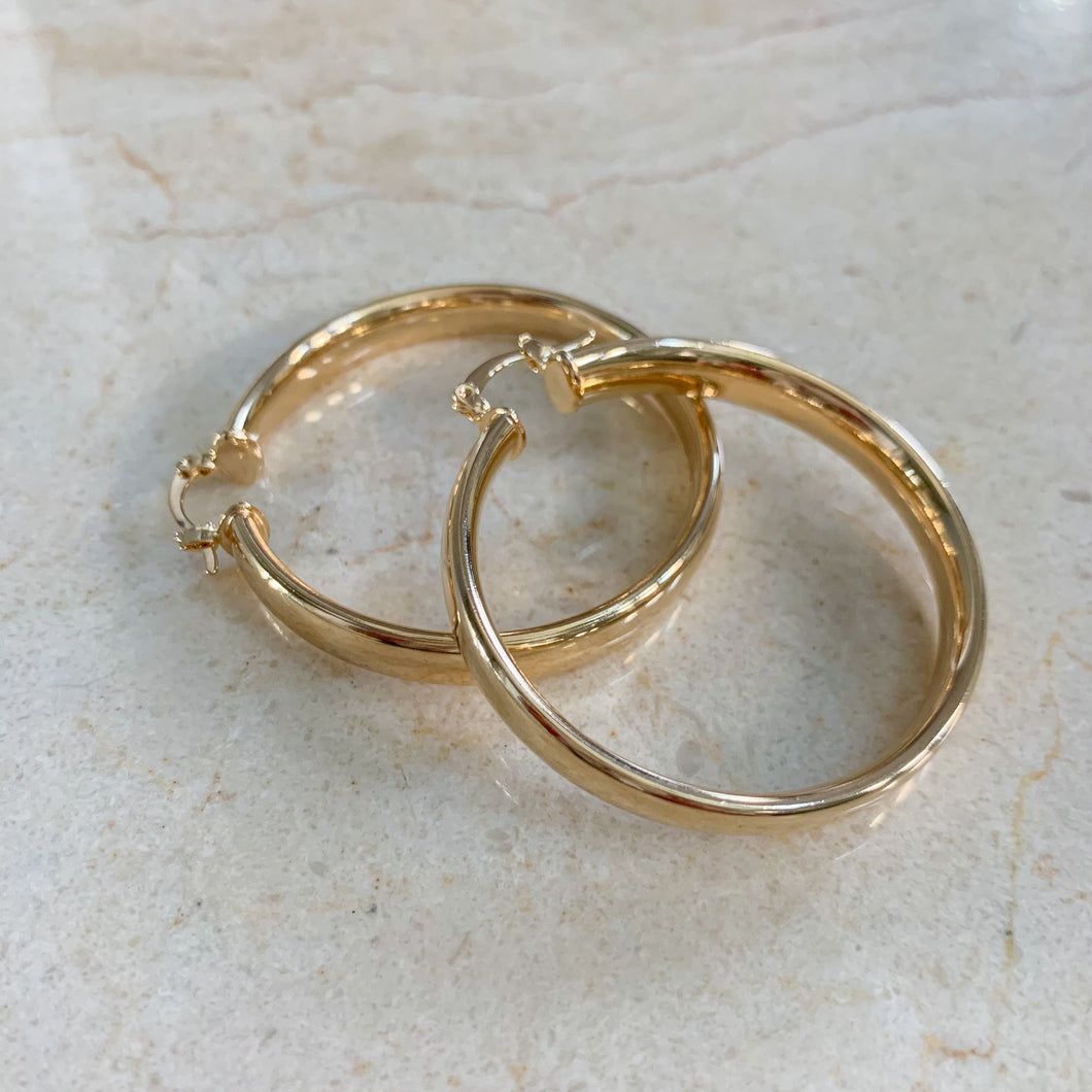 18k gold filled thick hoop earrings. Wide, flat, continuous hoop style with lever closure. Lightweight. High quality, tarnish resistant.