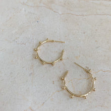 Load image into Gallery viewer, 18k gold filled thin hoop earrings with ball stud detail. Open hoop, push back closure. Lightweight, high quality, tarnish resistant. Shown in 1 inch size.
