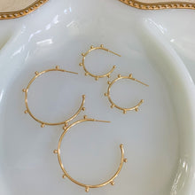 Load image into Gallery viewer, 18k gold filled thin hoop earrings with ball stud detail. Open hoop, push back closure. Lightweight, high quality, tarnish resistant. Shown in 2 available sizes - 1 inch and 1.75 inches.
