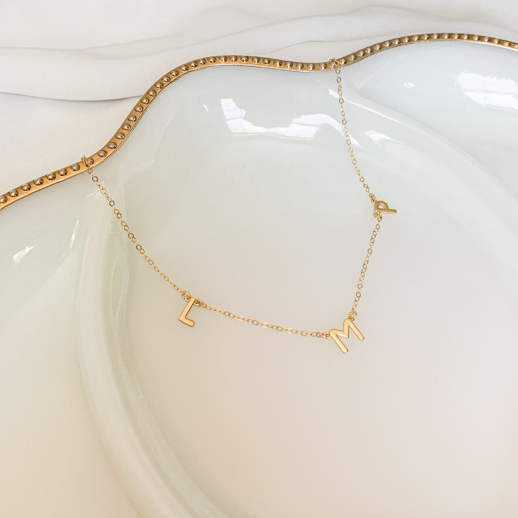 Custom 14k gold filled dainty initial necklace. High quality, tarnish resistant. Perfect for your or your kids’ initials or names, or to rep your brand.