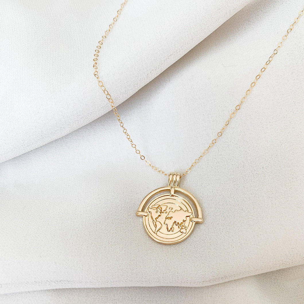 The Globe Trotter - 18k gold filled world/globe coin medallion on 14k gold filled cable chain. Jewelry for the traveler or adventurer. High quality, tarnish resistant. Great gift for graduation, retirement, promotion, or new job.