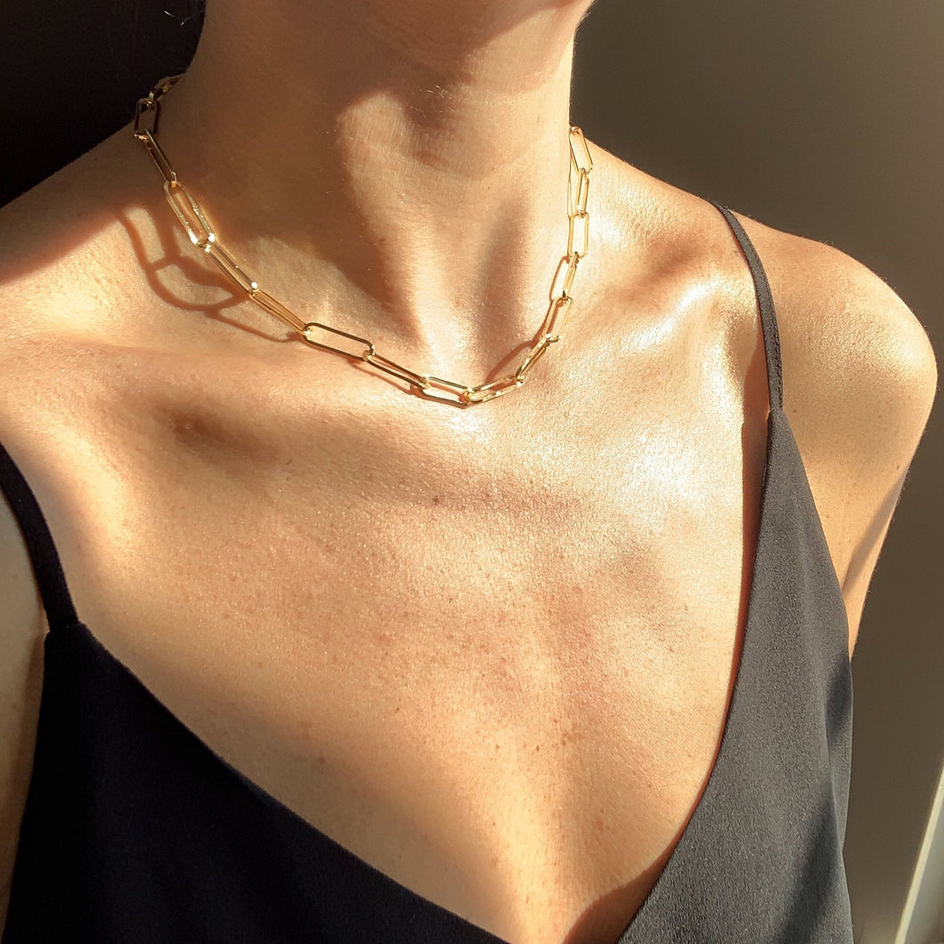 18k gold filled paperclip link chain. High quality, tarnish resistant chunky necklace perfect for everyday or layering. Shown on model at collarbone length.