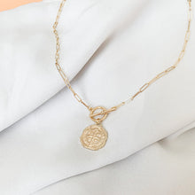 Load image into Gallery viewer, 14k gold filled paperclip link chain connected with a front toggle clasp and a rustic gold coin pendant. High quality, tarnish resistant. Chain length is customizable.
