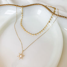 Load image into Gallery viewer, The Radiant One - 14k gold filled starburst with opal and clear CZ stones on 14k gold filled cable chain. High quality, tarnish resistant. Shown layered with our star charm chain.
