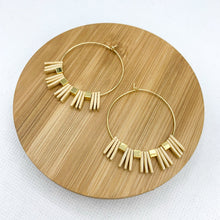 Load image into Gallery viewer, Geometric spiky beaded gold hoop earrings. Rectangle tan beads and square gold beads strung on thin 18k gold filled hoops.
